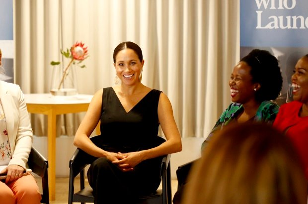 (HER ROYAL HIGHNESS: Duchess Meghan Markle laughs with the women at Woodstock Exchange. Photo: Bashiera Parker)